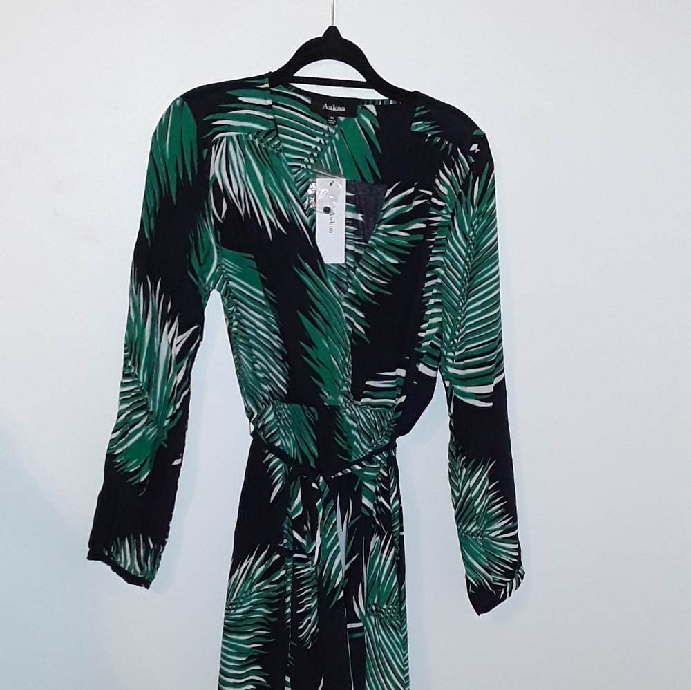 Long maxi dress. Has belt. Brand New.